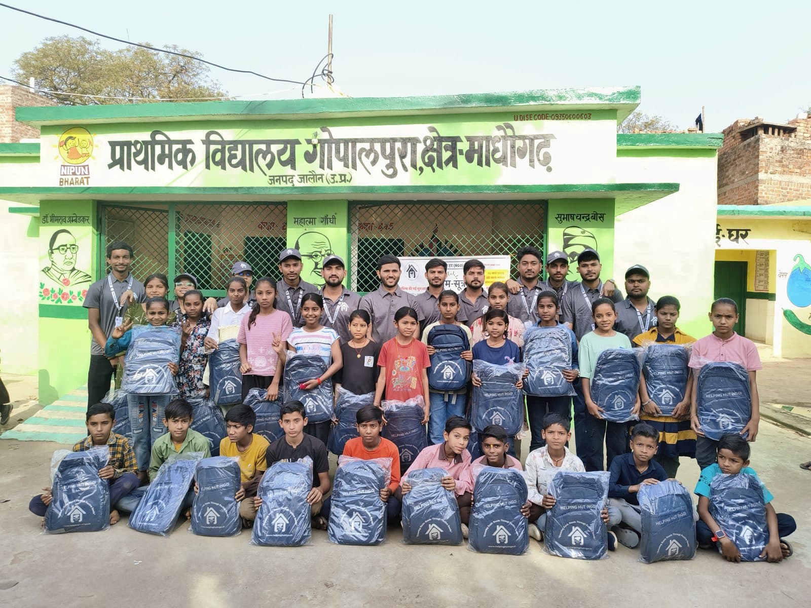 Children at Gopalpura's primary school holding Helping Hut kits