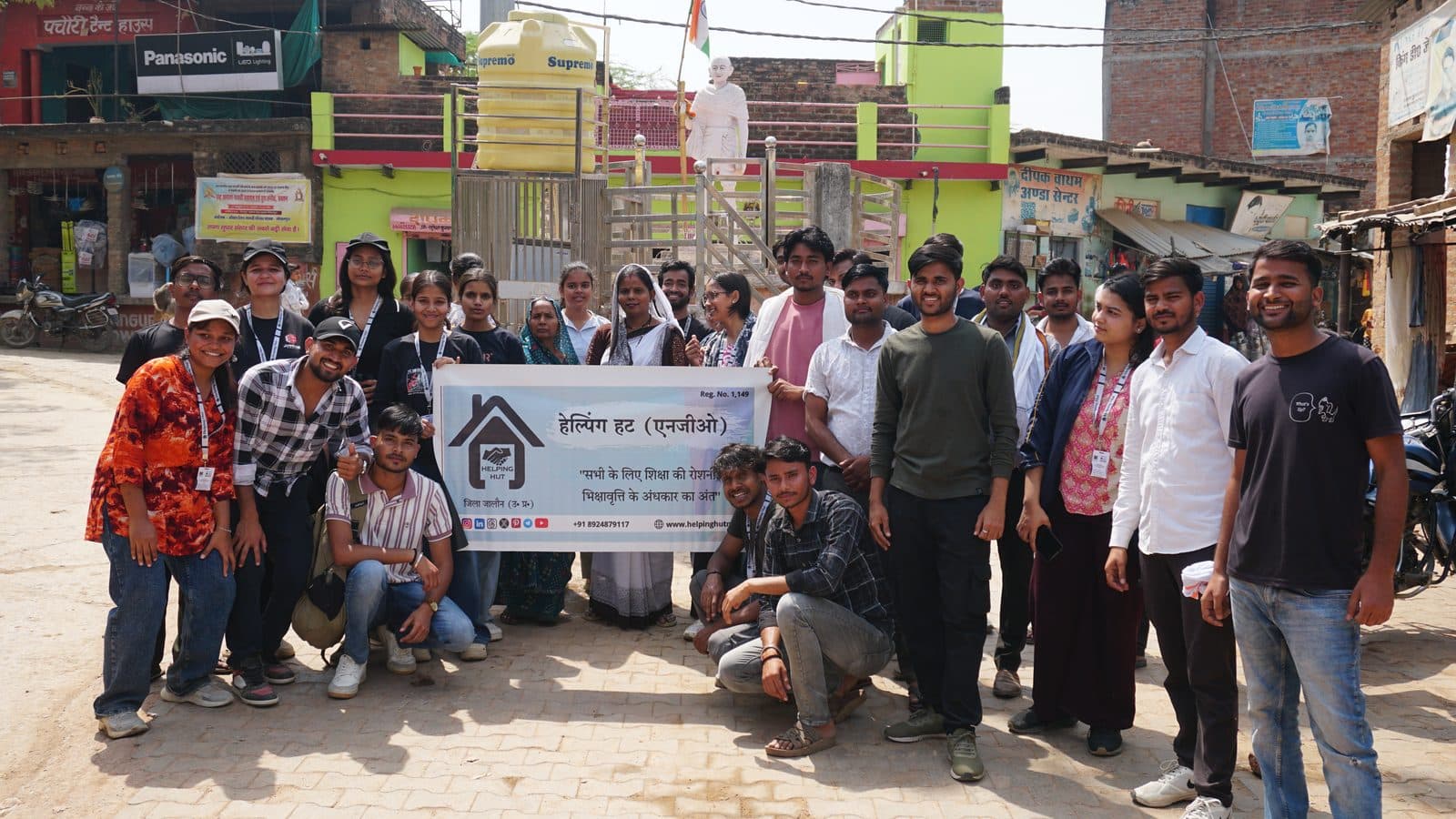 The team walking through the village market street in Gopalpura