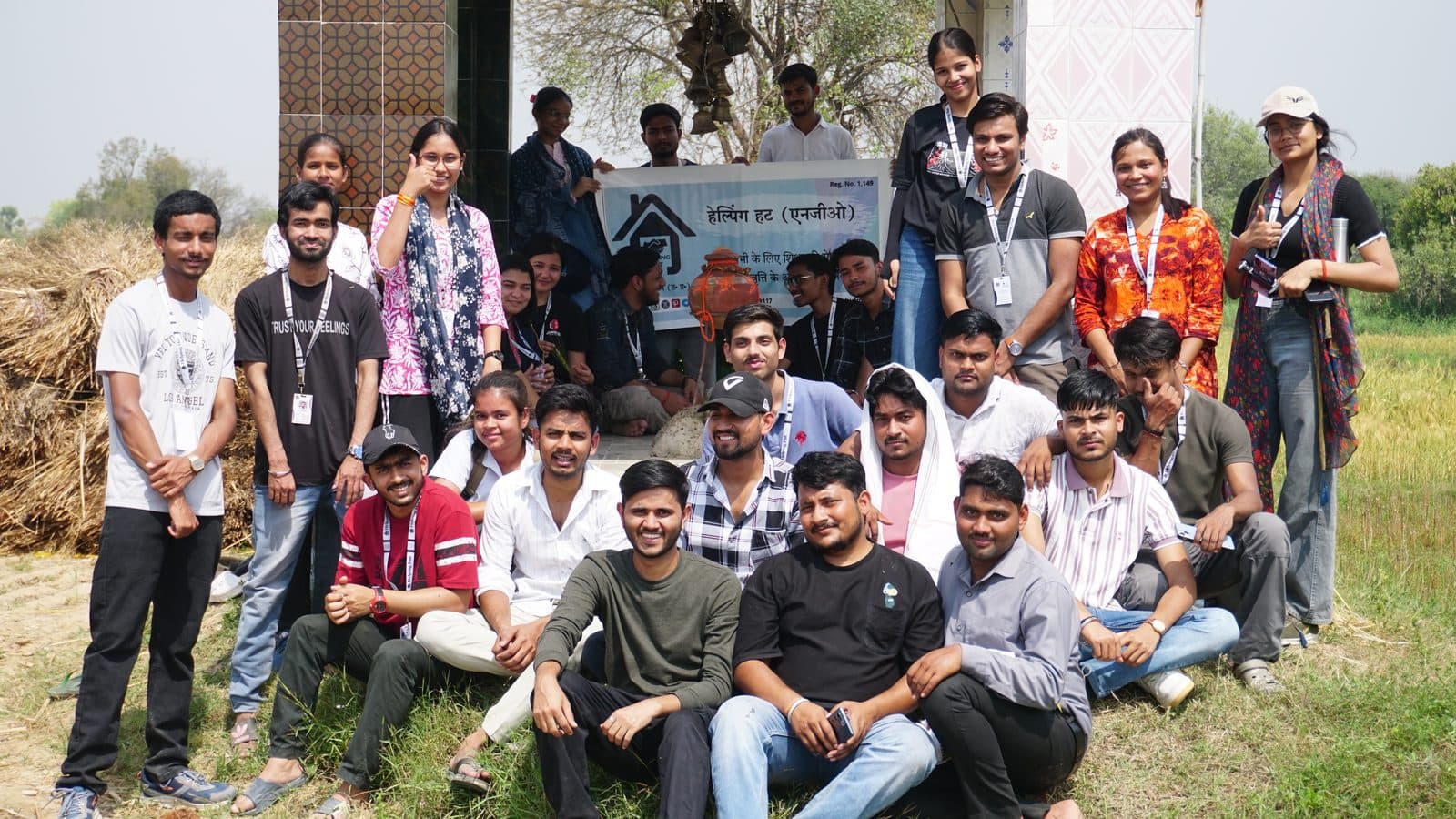 GramSutr volunteers gathered beside a village home in Gopalpura