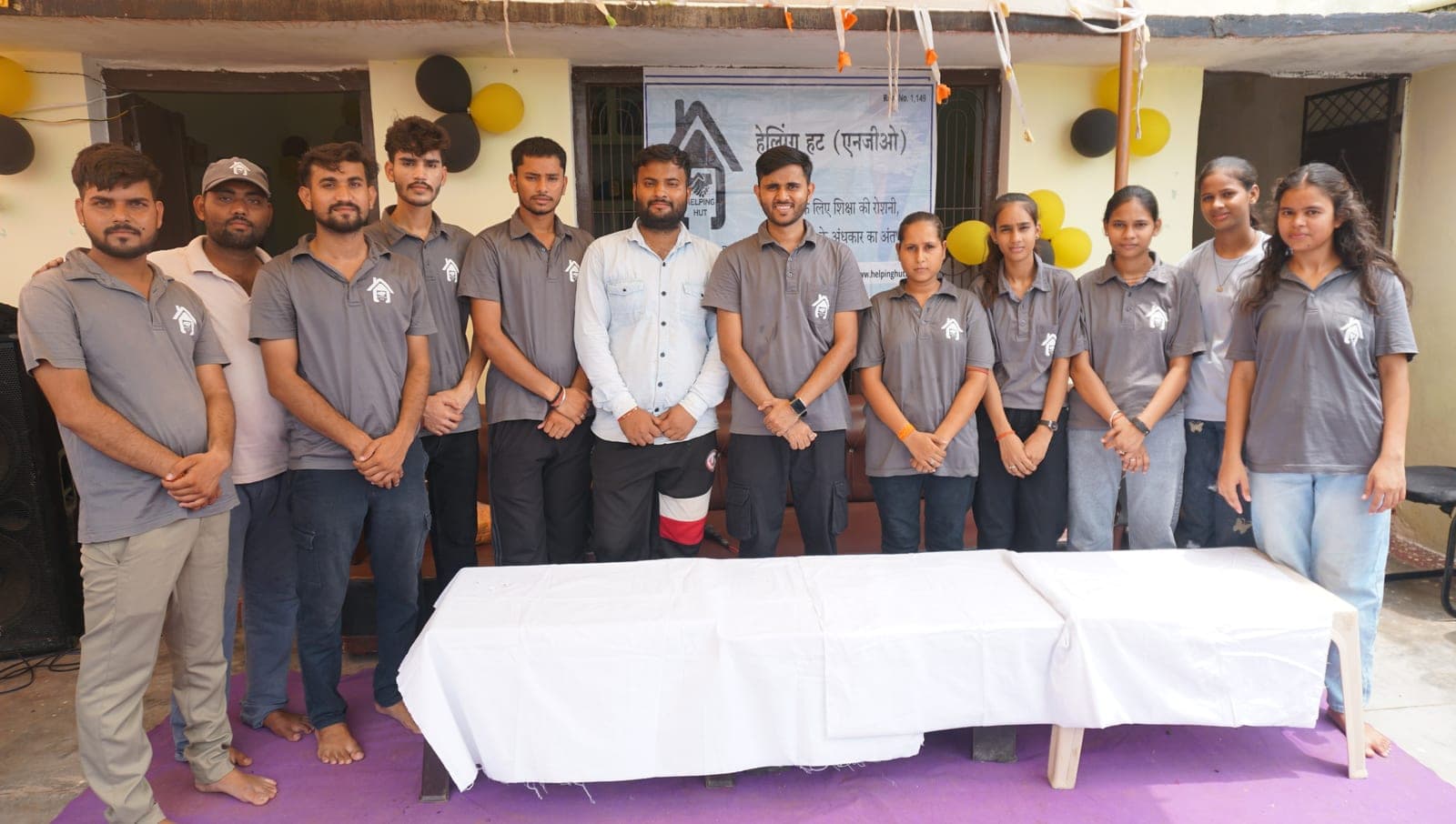The Helping Hut volunteer team standing together at the decorated GyanKutir venue