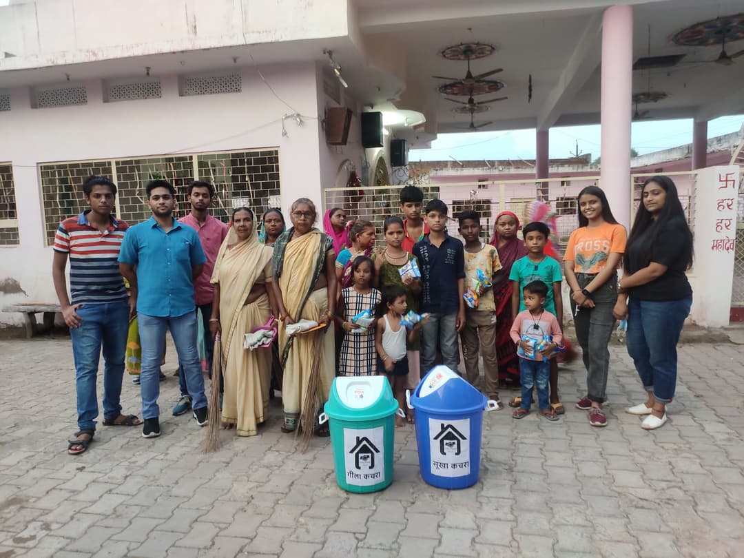 Women & volunteer in cleaning drive