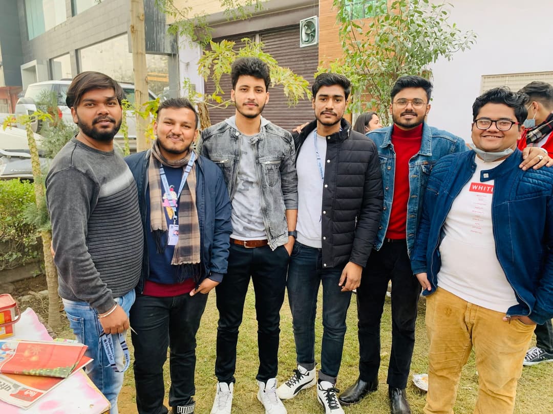 Six Helping Hut volunteers who ran the Charity Carnival, standing together